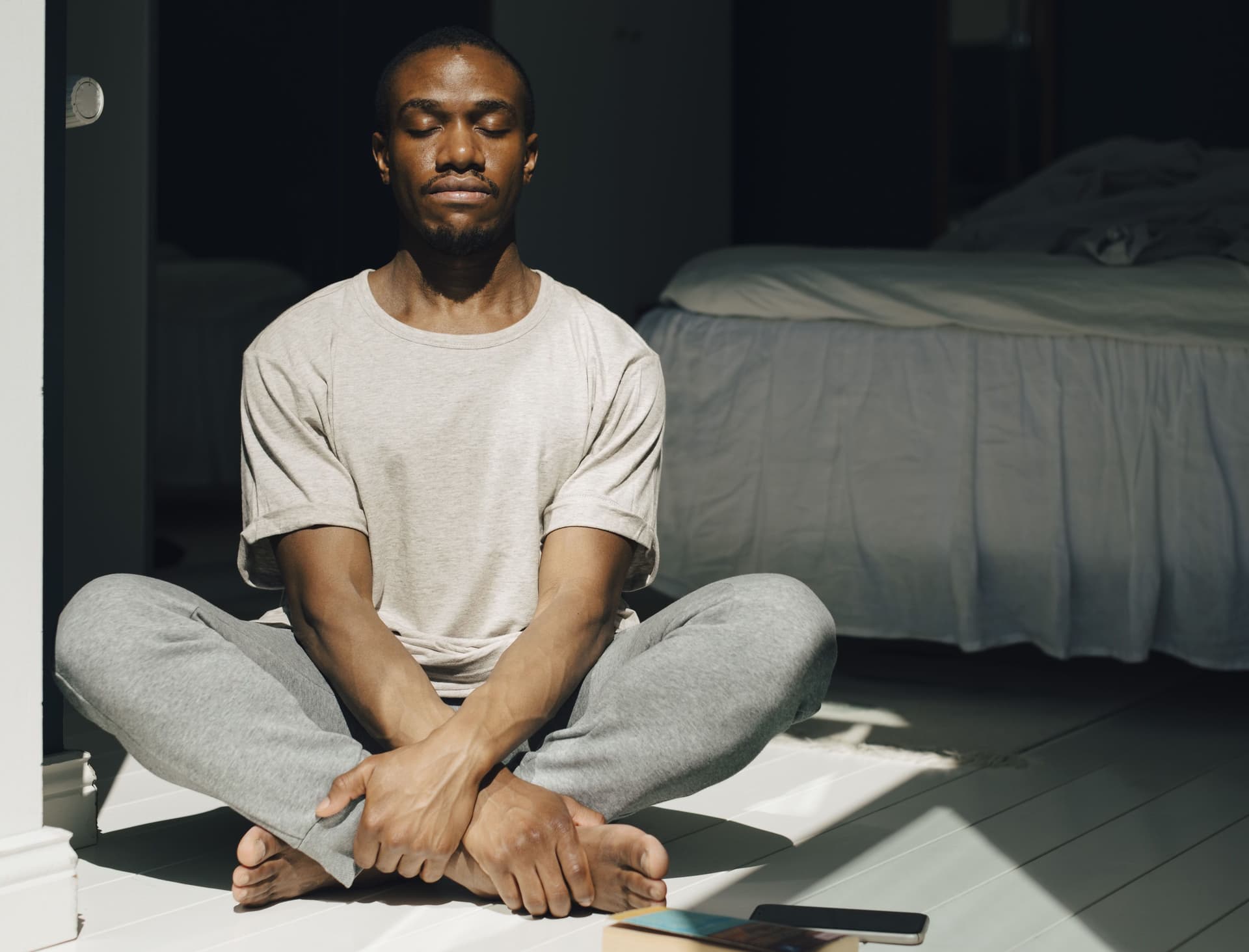 A person meditating as part of PMO recovery strategy